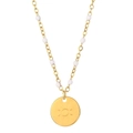 Detail of gold solar pendant necklace featuring white bead accents on a refined chain - Sun