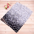 Classic black and white gradient polka dot chiffon scarf displayed on a wooden surface - Bubble Dot Black