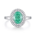 Luxurious S925 silver ring featuring a large oval emerald green stone with halo diamonds - US 6 / Paraiba Blue