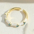 Verstelbare evil eye ring met wit emaille en blauwe zirkoon details in goudkleur - Verstelbaar Open / Wit