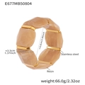 Detailed view of elastic resin bracelet with marble texture and stainless steel parts - 60mm / Beige (E677)