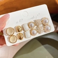 Detailed view of a 12-piece pearl and geometric gold earring set on jewelry card - Gold/White (1# Steel Earring Post)
