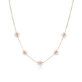 Gold daisy necklace with small pearl flowers and round zircon beads on white background - Gold Flower Pearl Necklace