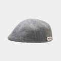 Detail shot of a grey wool beret featuring the JISIZAN.LING brand label on the side - One Size / Gray