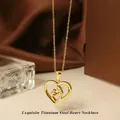Detailed close-up of golden titanium steel heart necklace with mother and child pendant - Gold Heart Necklace N0452G