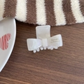 French style pearlescent white bow hair claw clip with gold Barrette La France lettering - White