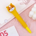 Cute yellow Shiba Inu cartoon squishy pen for stress relief on a pink background - Corgi