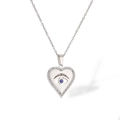 Detailed view of silver heart pendant with evil eye motif and sparkling zircon stones - Silver