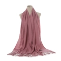 Detail showing soft dusty pink cashmere-like scarf with fringe and woven material label - Leather Red
