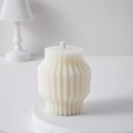 Minimalist cream geometric pillar scented candle with elegant vertical ribbed texture - White