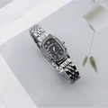 Elegant women's quartz watch with oval black dial and rhinestone bezel on silver band - Silver Black