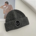 Minimalist dark grey knitted wool beanie featuring a round black animal embroidery patch - 55-59CM / Dark Gray
