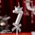 Silver number 7 birthday candle with mini crown and glittery bow detail, 6cm size - Number Candle Silver 7 With Crown And Bow