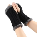 Black cable knit fingerless gloves with grey faux fur trim worn by a model - One Size / Black 1#