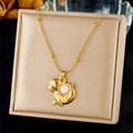 Golden sea lion pendant necklace with white pearl on a beige cushioned display box - Cartoon Animal Holding Pearl (N3476)
