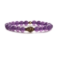 Elastic beaded bracelet with natural amethyst stones and a bronze Buddha head charm - Bronze Buddha Head / Purple Crystal