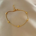 Elegant gold snake chain necklace with small beads on champagne silk background - Round Bead Snake Chain Bracelet / Gold