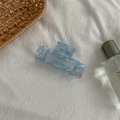 Detail of light blue marble pattern acetate hair claw clip on white fabric background - Medium Square Claw / Sky Blue