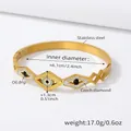 Detailed view of golden stainless steel Evil Eye bangle with blue oil drip and Czech diamonds - Evil Eye Style (Z070) / Gold