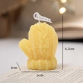 Yellow knitted glove scented candle with textured finish on a decorative book - Yellow Gloves - Lime Basil & Mandarin