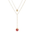 Detail of double-layer gold necklace with irregular pendant and red-orange natural stone - Deep Red Natural Stone
