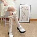 White Japanese JK style lace calf socks with delicate bow and flower button accents - One Size / Front Sunflower White