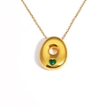 Detail of 18k gold plated necklace with green heart gemstone and dainty chain link - Letter O