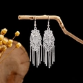 Ethnic style silver tassel earrings with delicate hollow flower design on wooden branch - Silver Hollow Flower Metal Bar Tassel Style (E2871-8)