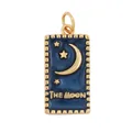Close-up of a gold-framed blue enamel tarot pendant with The Moon and star motifs - Tarot Moon Navy Blue Enamel