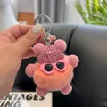 Porte-clés monstre en peluche rose avec bonnet en tricot et lunettes - Rose Poudré