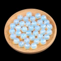 12mm translucent white semi-drilled opal beads for DIY earrings on a wooden tray - 12mm Synthetic Opalite Semi Drilled Bead