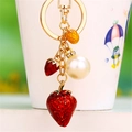 Golden keychain with red strawberry pendants and a large pearl accessory for bags - Single OPP Bag Packaging / Red Pearl Strawberry