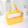 Waterproof clear yellow TPU travel toiletry bag with PU leather handle and zipper closure - Yellow Medium