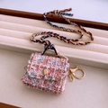 Pink tweed mini bag pendant with golden buckle and multicolor woven strap shown on velvet - 15# Necklace-Pink-Bag (Pink Tweed Bag)