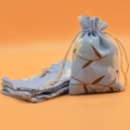 Blue cotton drawstring pouch with white floral pattern for jewelry and gifts - Orchid