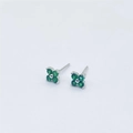 Close-up of S925 sterling silver four-leaf clover stud earrings with green gemstones - Silver With Green Zirconia