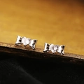 Silver bow stud earrings featuring a heart-shaped zircon on a premium dark velvet base - Butterfly Bow Heart Rhinestone Style (A131)