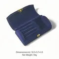 Detail view of compact navy velvet jewelry box showing ring slots and metal clasp - Plush Style / Blue