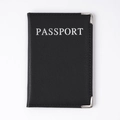 Black PU leather passport cover with silver lettering and metal corners on a white background - Black