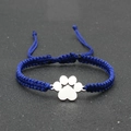 Detail of blue hand-woven lucky bracelet with adjustable knot and silver paw pendant - Blue