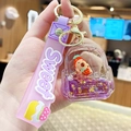 Purple Capybara keychain with strawberry hat in liquid sand drifting bag charm - Capybara Holding Strawberry - Backpack