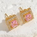 Detailed close-up of square pink zircon stud earrings with gold plating on a stone base - Pink