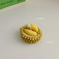 Durian shaped handmade scented candle with realistic yellow pulp and green shell details - Durian