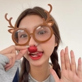 Brown reindeer antler party glasses with red sequin nose detail shown on a model - Brown Antlers with Nose Clip