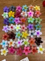 Set of colorful frangipani flower hair claws in purple, yellow, pink, and blue - Custom Color