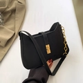 Chic black faux suede baguette bag with golden chain strap and metallic buckle - Black