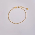 Detail of golden stainless steel box chain bracelet with lobster clasp and tag - Box Chain