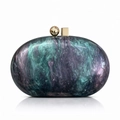 Detail of marble pattern acrylic evening clutch with gold geometric clasp closure - Navy Blue