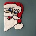 Macro detail of tufted Santa Claus Christmas floor mat with soft plush texture - Christmas Style 10