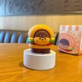 Cute resin figurine featuring a dog character inside a hamburger bun on a pedestal - Burger Dog
